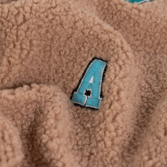 Boucle letters taupe Tissus Quality Textiles 