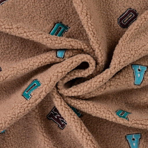 Boucle letters taupe Tissus Quality Textiles 