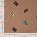 Boucle letters taupe Tissus Quality Textiles 