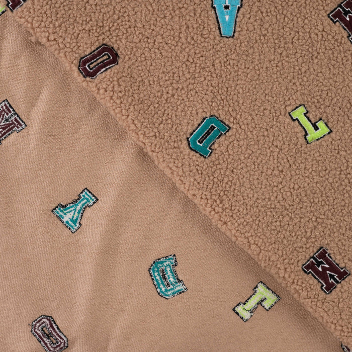 Boucle letters taupe Tissus Quality Textiles 